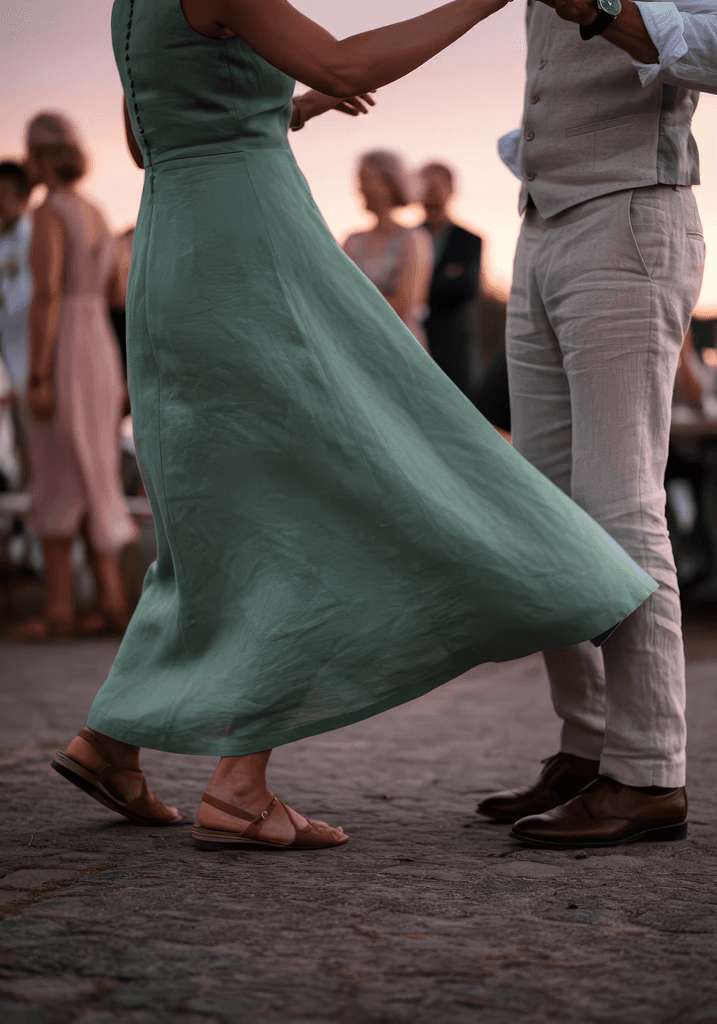 Couple dancing with flowing green dress